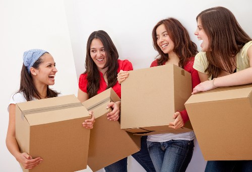 Careful loading of household items into a removals van