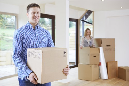Man with van loading furniture for a scheduled UK move