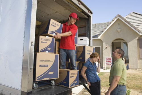 Boxes and furniture being unloaded during a Wood Green home relocation