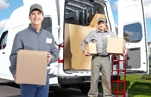 Removals crew handling household items in a local Wood Green move