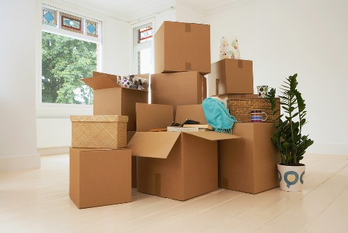 Careful wrapping of fragile household items during packing