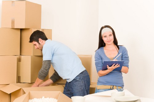 Movers loading furniture for a home relocation in Wood Green